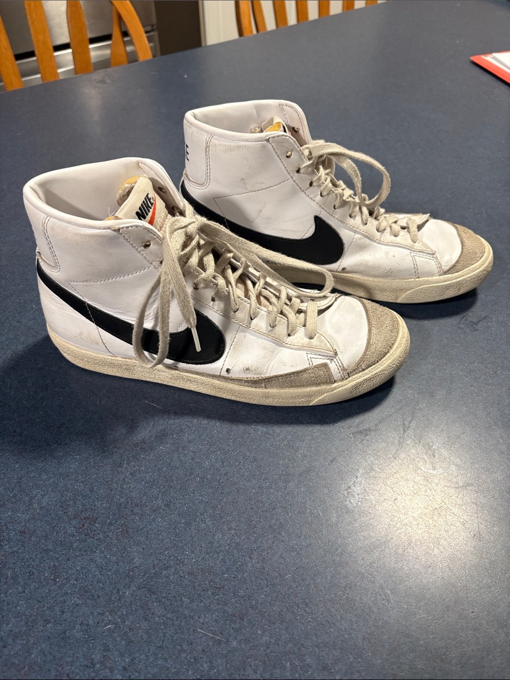 Nike White High-Top Sneakers with Black Swoosh